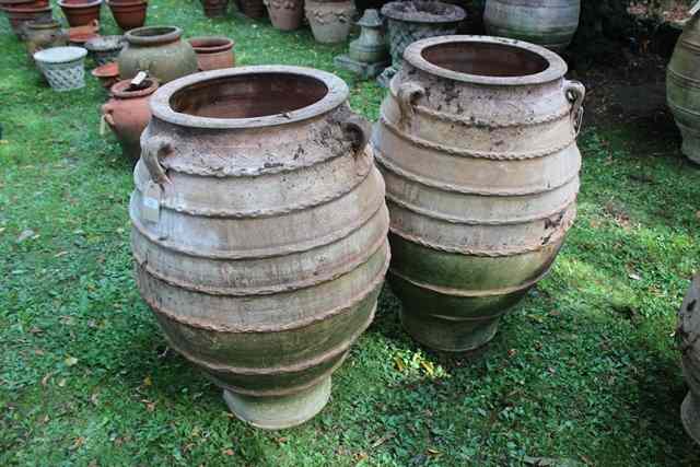 Appraisal: A LARGE PAIR OF OVOID TERRACOTTA PLANTERS or jars with