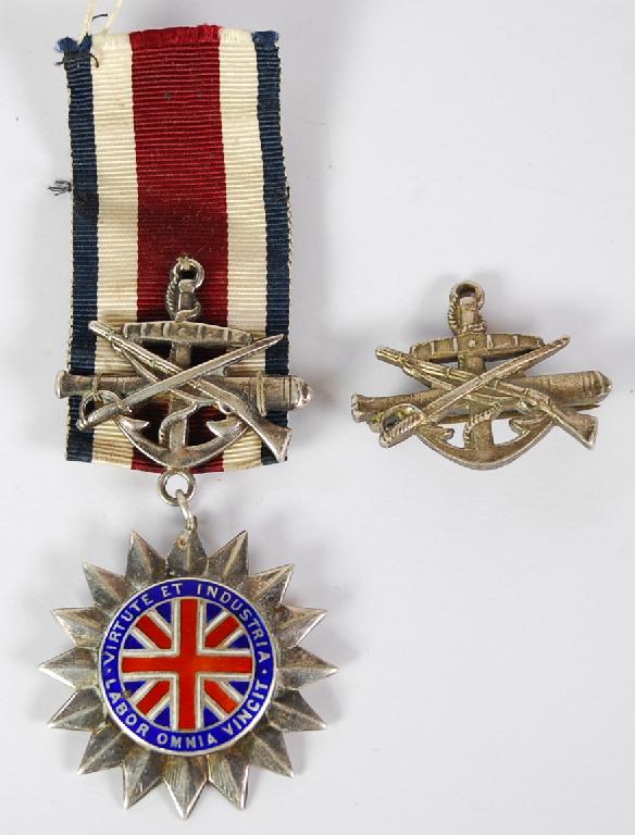 Appraisal: CORPS OF COMMISSIONAIRS SILVER AND ENAMEL STAR SHAPED MEDAL the