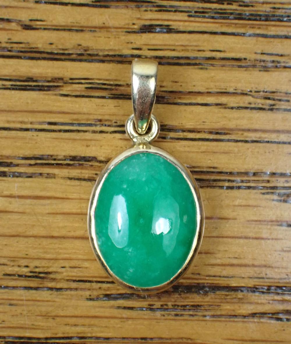 Appraisal: JADE AND EIGHTEEN KARAT GOLD PENDANT The k gold pendant