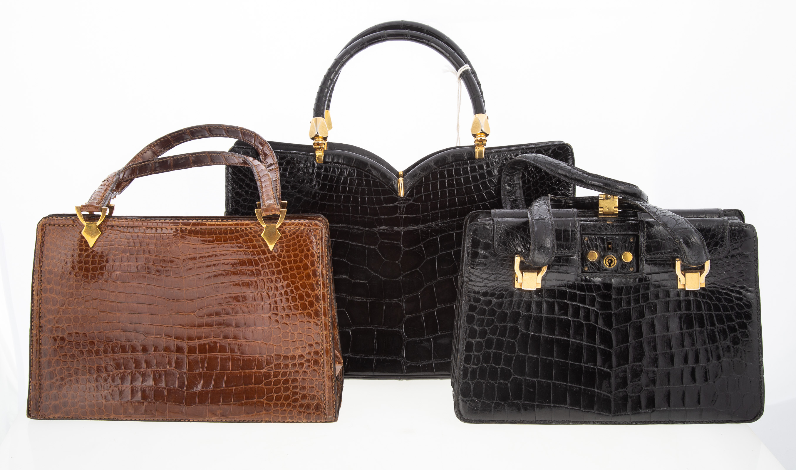 Appraisal: THREE EXOTIC SKIN HANDBAGS including a Rosenfeld black alligator in