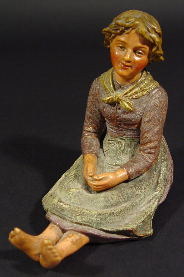 Appraisal: French terracotta young girl with hand painted decoration impressed numbers