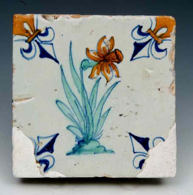 Appraisal: AN ANTIQUE DUTCH DELFT TILE decorated with a daffodil square