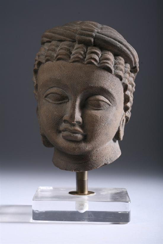 Appraisal: INDIAN SANDSTONE HEAD OF BODHISATTVA th century or earlier -