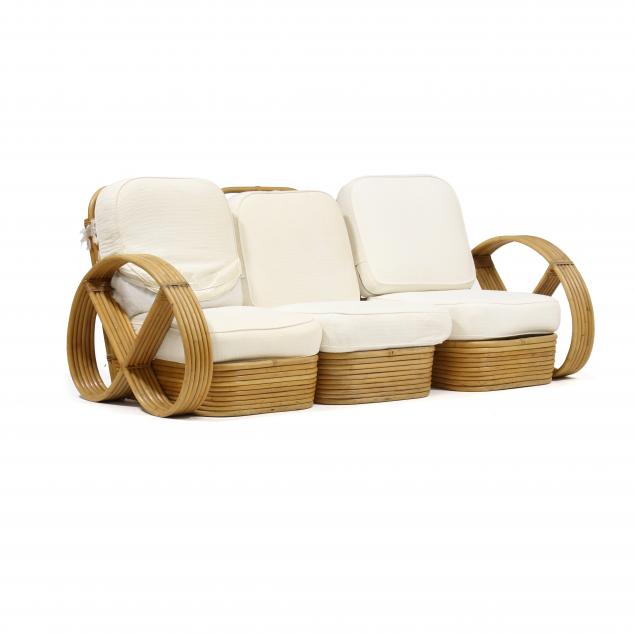 Appraisal: AFTER PAUL FRANKL RATTAN PRETZEL SOFA s Tochiku Industry Co