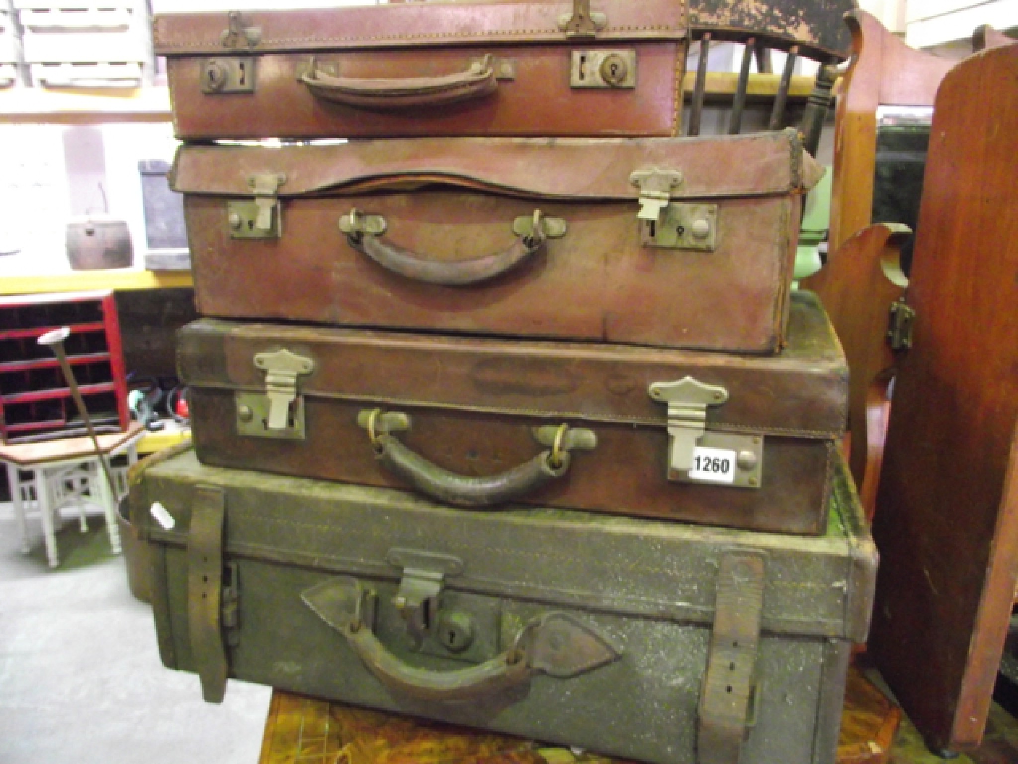 Appraisal: A green canvas leather banded suitcase a leather suitcase and