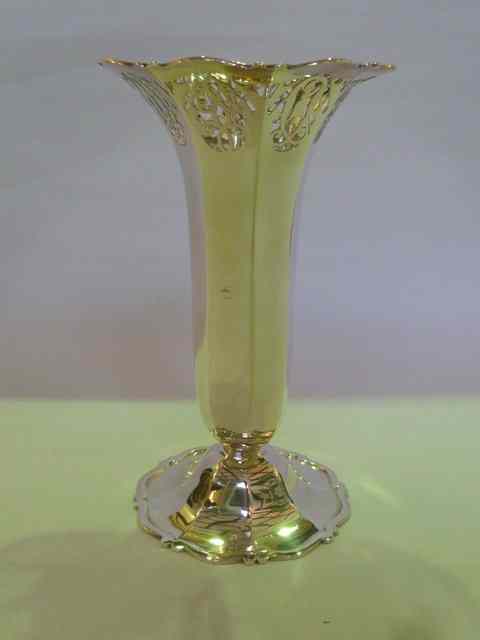 Appraisal: A SILVER ROSE VASE of octagonal form on pedestal foot