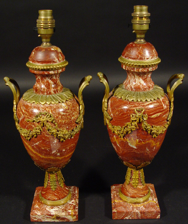 Appraisal: Pair of ormolu mounted red marble table lamps of baluster