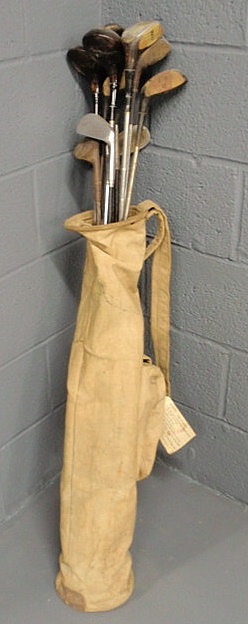 Appraisal: Canvas bag of early golf clubs some with wood shafts