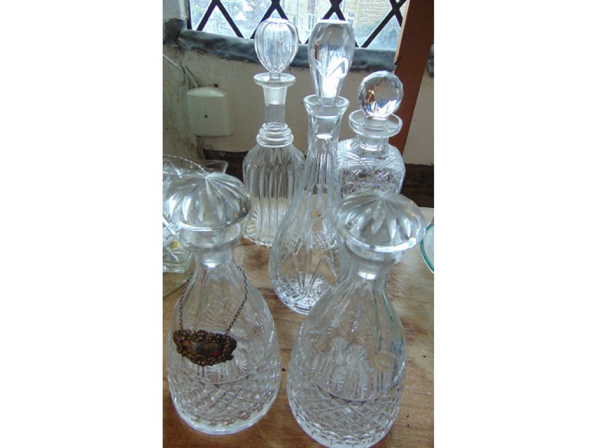 Appraisal: A pair of clear cut glass decanters with slice cut