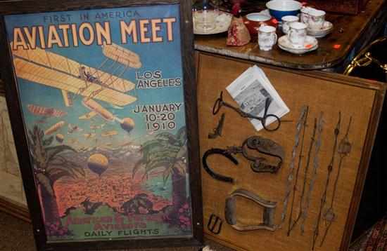 Appraisal: Reproduction early aviation poster framed and a mounted barbwire collection