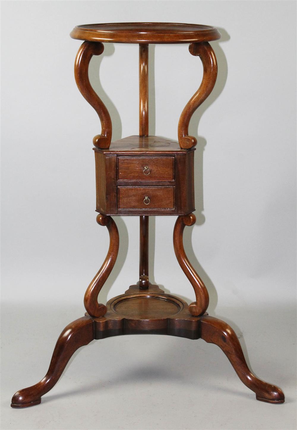 Appraisal: GEORGE III MAHOGANY BASIN STAND the circular molded recess on