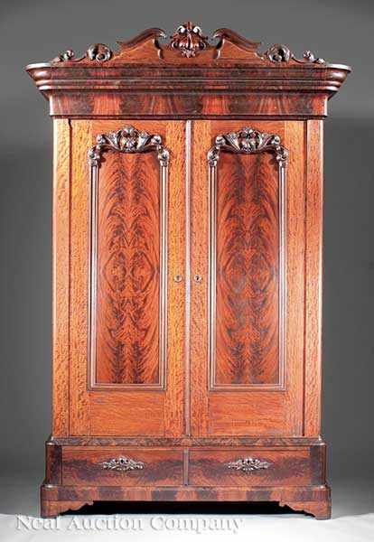 Appraisal: An American Rococo Carved Mahogany Armoire c arched fruit and