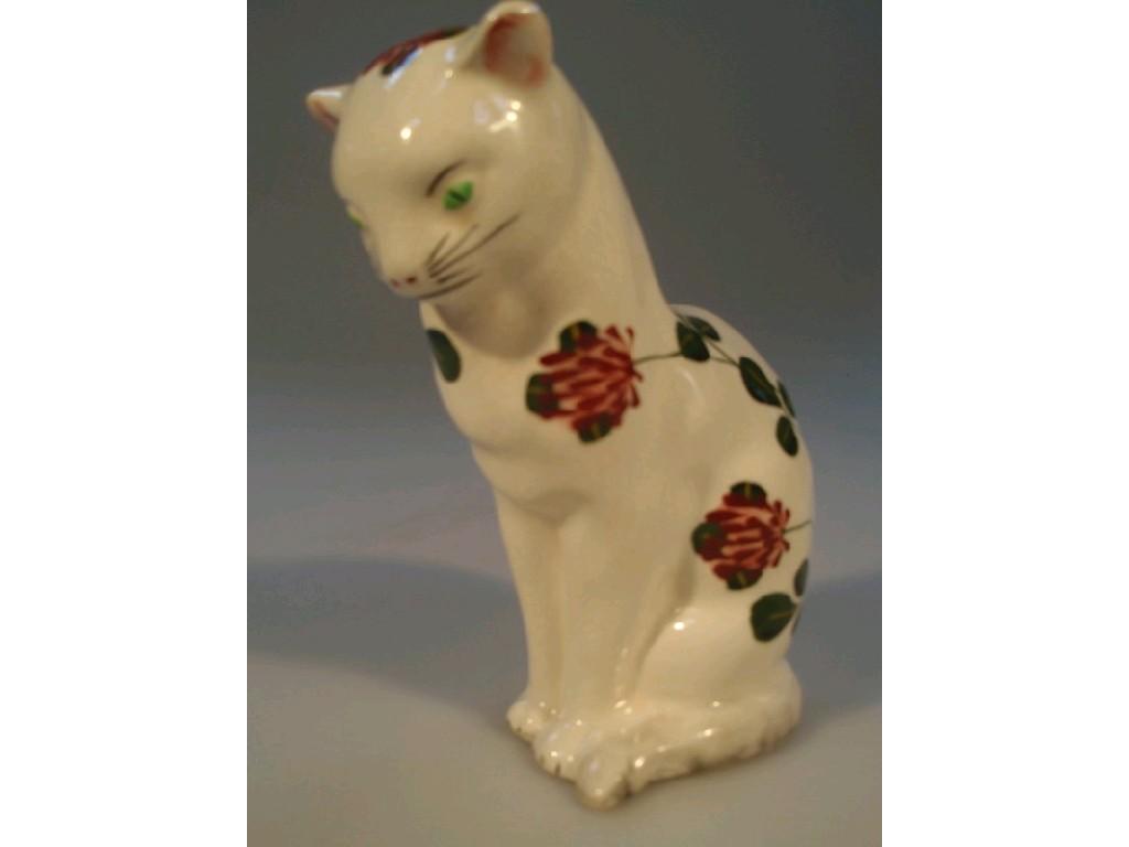 Appraisal: A Plichta model of seated cat with hand painted clover