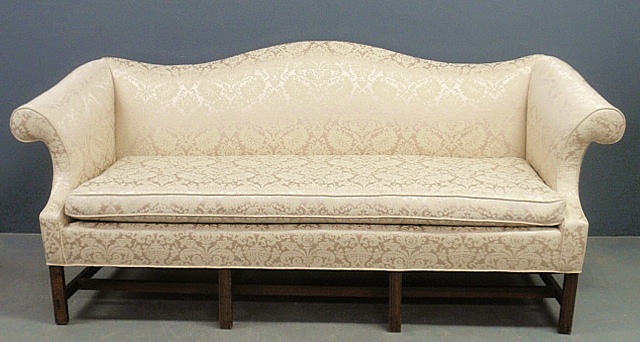 Appraisal: - Chippendale style camelback sofa with molded square legs h