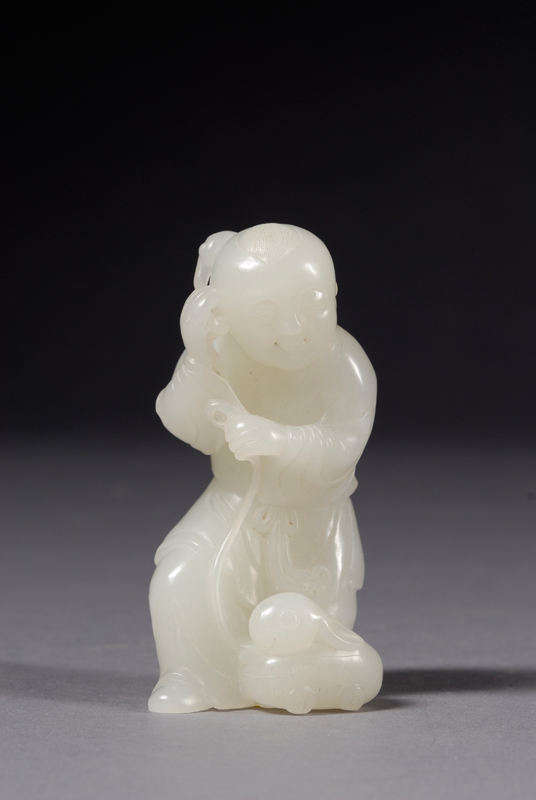 Appraisal: Jade Carving China pale green-white stone depicting a small boy