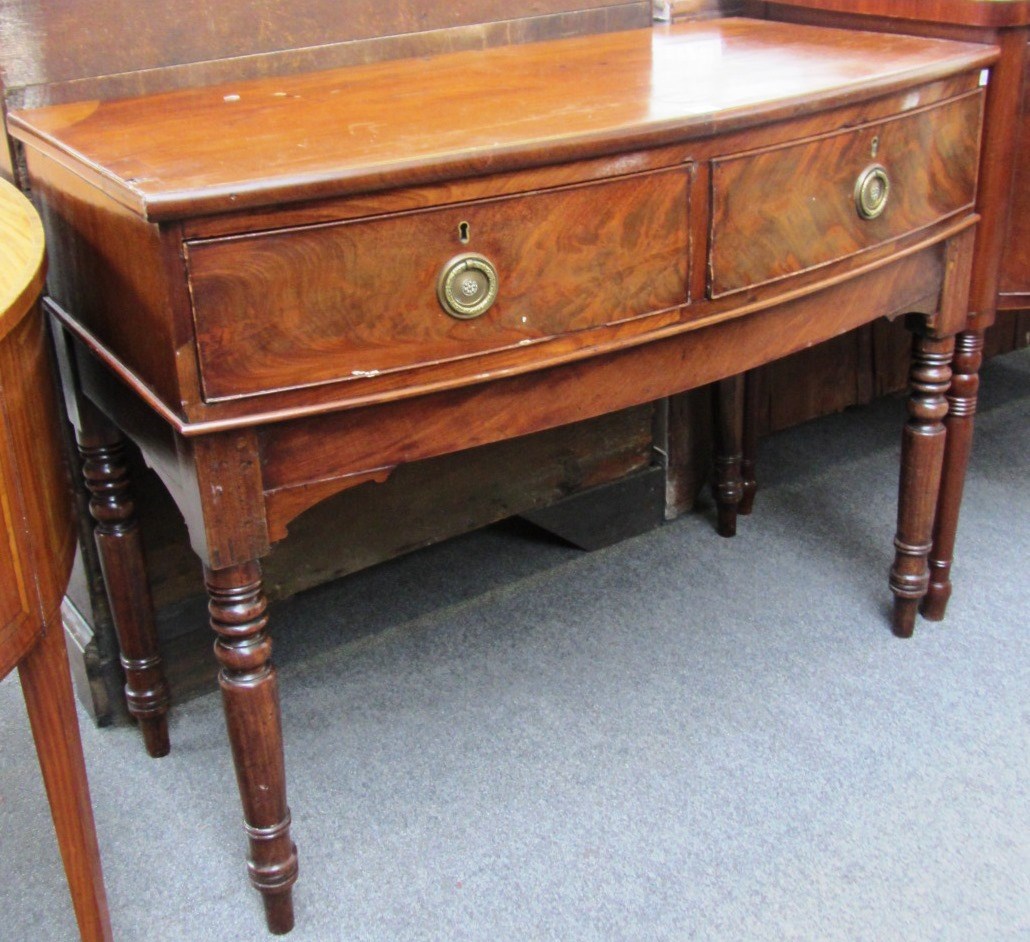 Appraisal: A made up th century mahogany bowfront two drawer serving