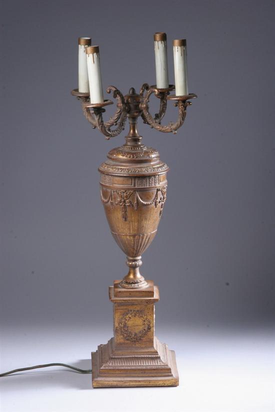 Appraisal: EMPIRE-STYLE GILT-METAL FOUR-LIGHT TABLE LAMP th century Urn-form body on