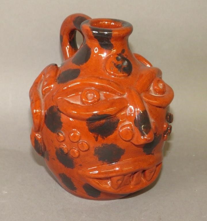 Appraisal: SMALL FOLK ART REDWARE FACE JUG BY JAMES C SEAGRAca