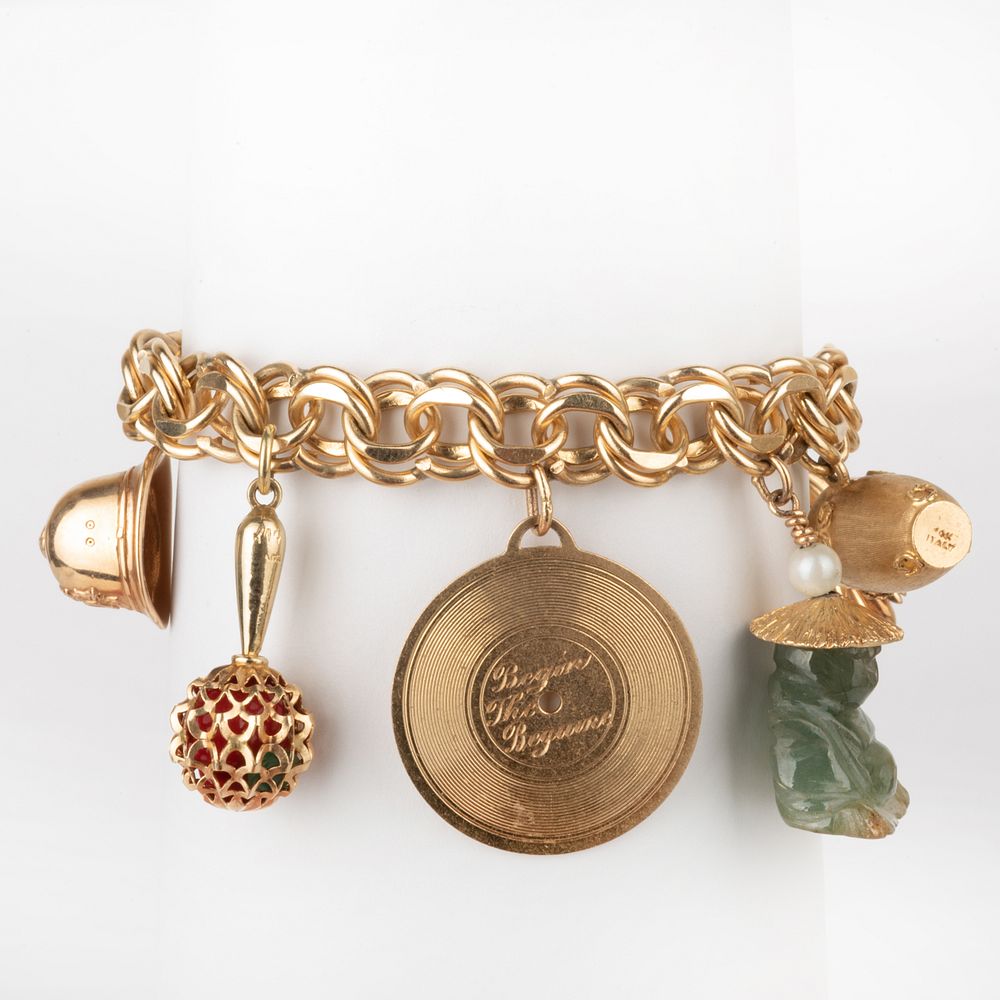 Appraisal: k Gold Charm Bracelet Marked ' k PAT ' with