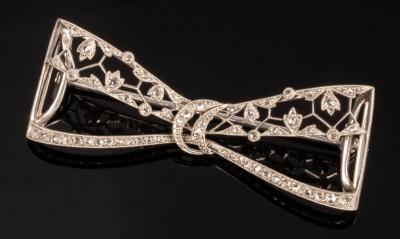 Appraisal: A diamond set bow brooch of openwork form cm wide