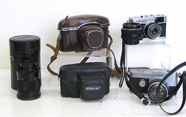 Appraisal: A group of six cameras and lenses Including makers Nikon