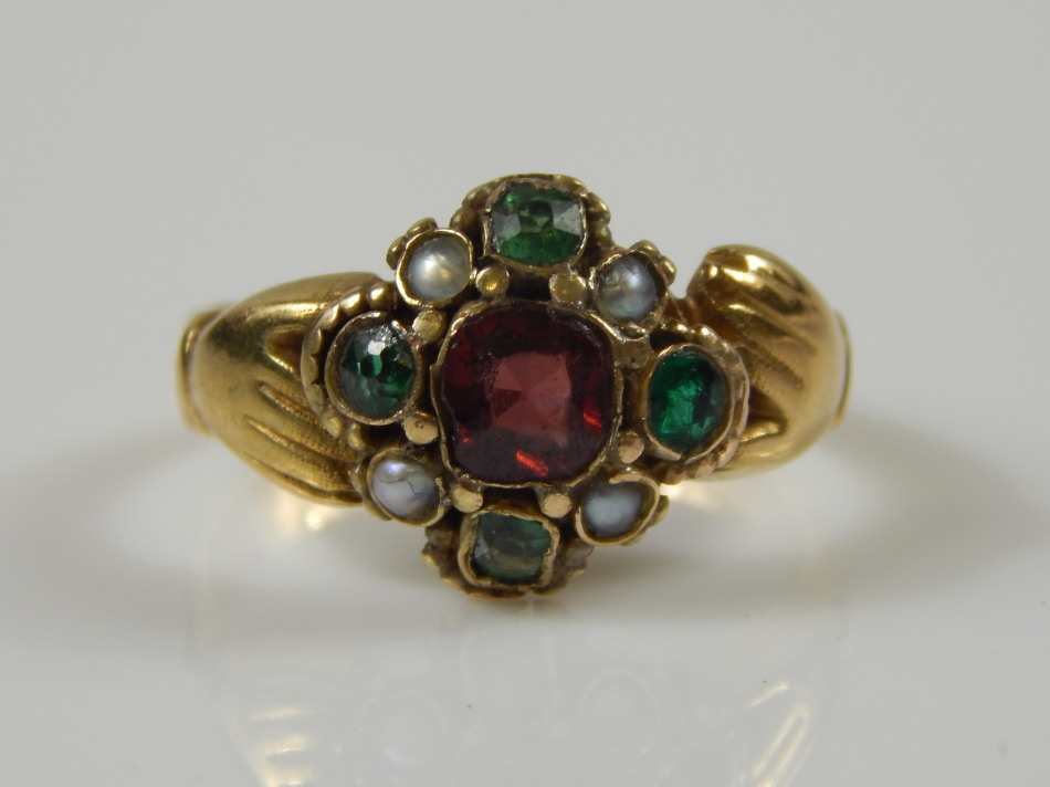 Appraisal: A Victorian dress ring set with garnet emerald and seed