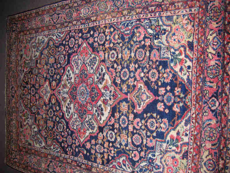 Appraisal: HAMADAN THROW RUG The indigo herati field centering an oversized