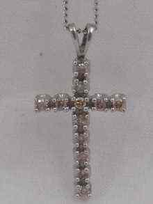 Appraisal: A white metal tests carat white gold diamond set cross