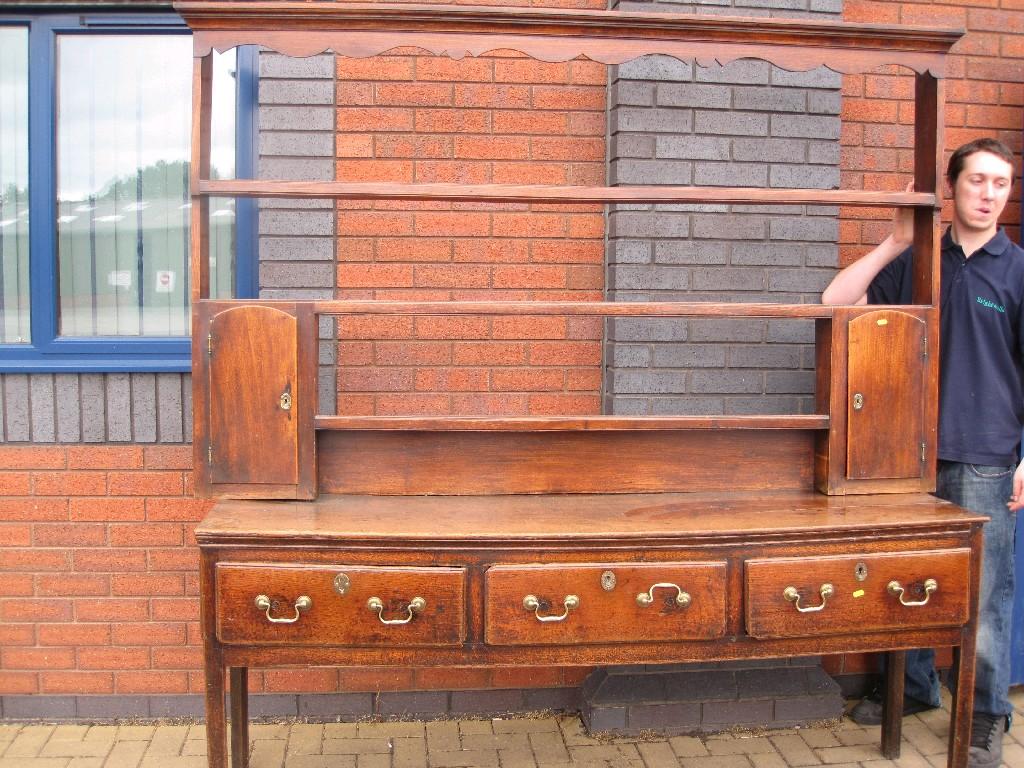 Appraisal: An antique oak Dresser Base fitted three drawers on chamfered