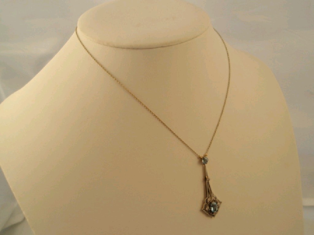 Appraisal: An Edwardian style aquamarine and diamond set pendant in a