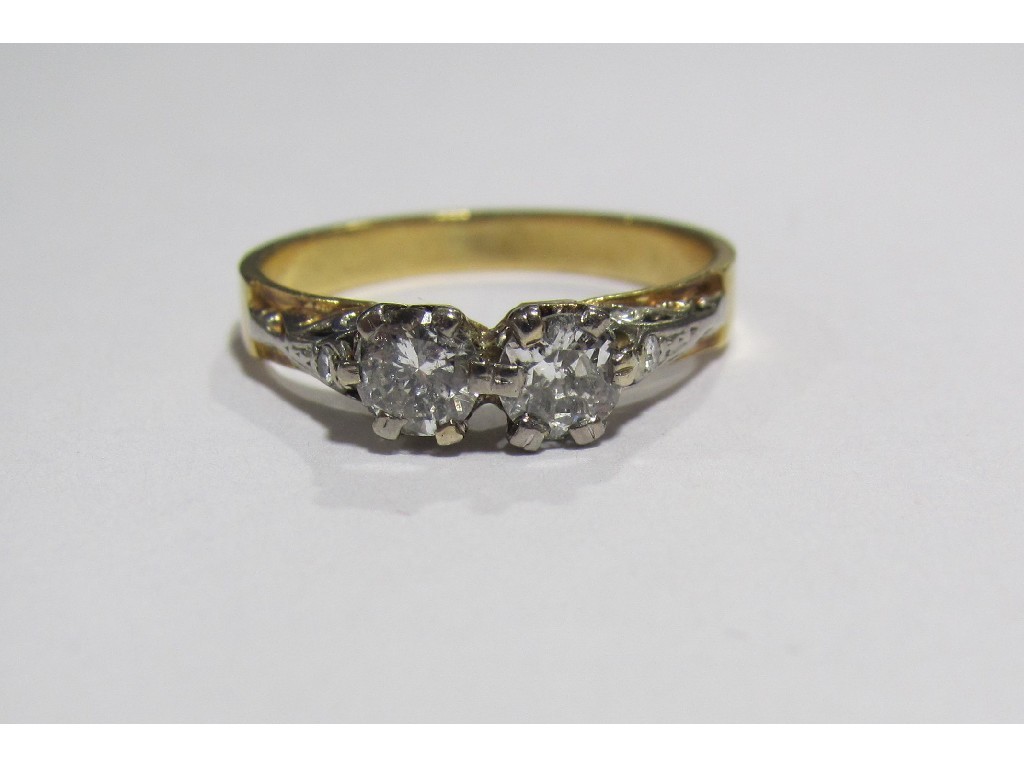 Appraisal: Eighteen carat gold twin stone diamond set dress ring with