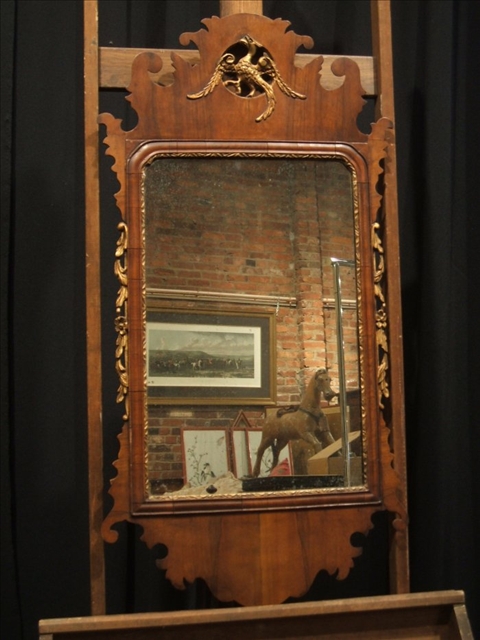 Appraisal: CHIPPENDALE STYLE WALNUT MIRROR th century the rectangular mirror plate