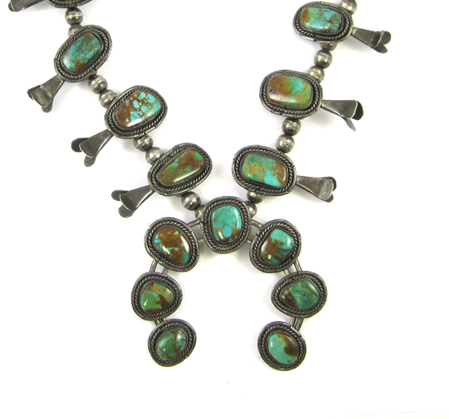 Appraisal: NAVAJO SQUASH BLOSSOM NECKLACE with natural turquoise cabochons set in