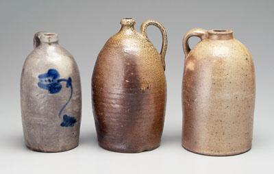 Appraisal: Three salt glazed stoneware jugs one with cobalt flower unmarked