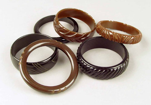 Appraisal: Six bakelite bangles in brown and black shades with carved