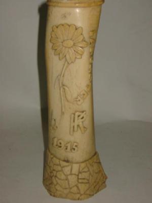 Appraisal: A PRISONER OF WAR BONE CARVING depicting a flower inscribed