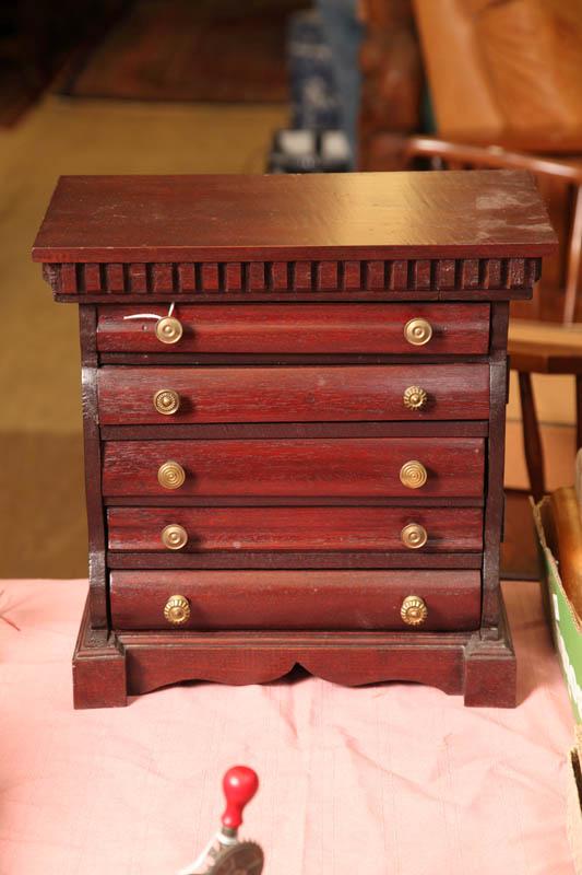 Appraisal: MINIATURE CHEST OF DRAWERS Mahogany having a dentil carved cornice