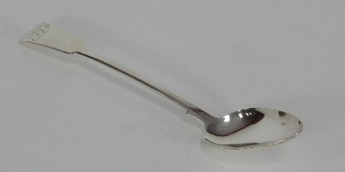 Appraisal: A silver serving spoon London of fiddle pattern and monogrammed