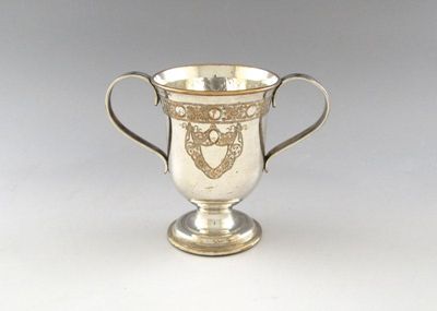 Appraisal: A George III old Sheffield plated two-handled cup circular form