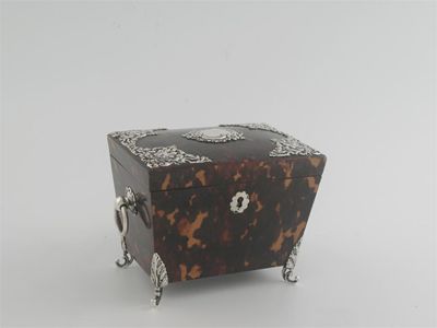 Appraisal: A late Victorian mounted tortoiseshell tea caddy on scroll feet