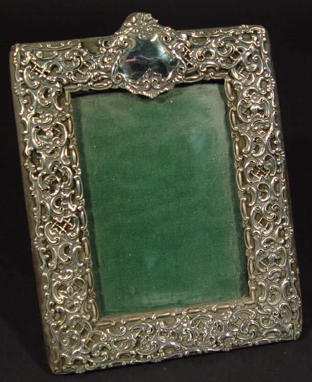 Appraisal: Late Victorian rectangular silver photo frame with embossed and pierced