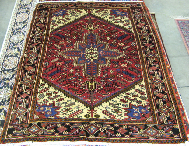 Appraisal: PERSIAN HERIZ AREA RUG ' x '