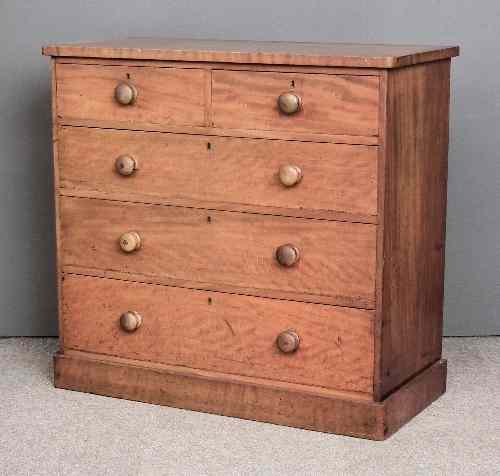 Appraisal: A Victorian figured mahogany chest of drawers with rounded front