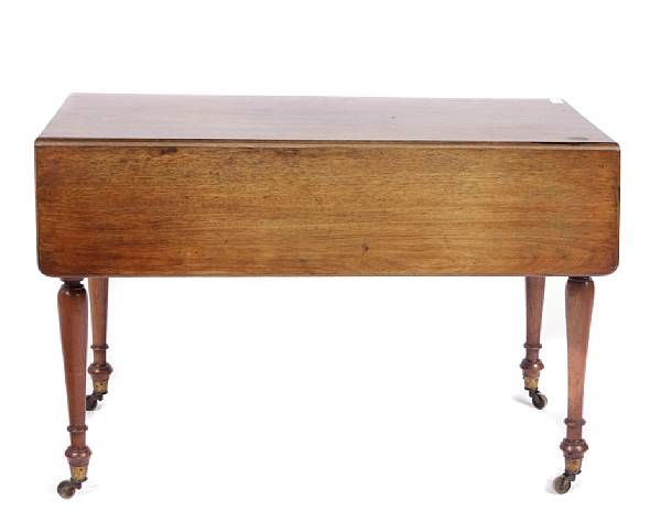 Appraisal: An English Victorian mahogany drop leaf table with turned legs