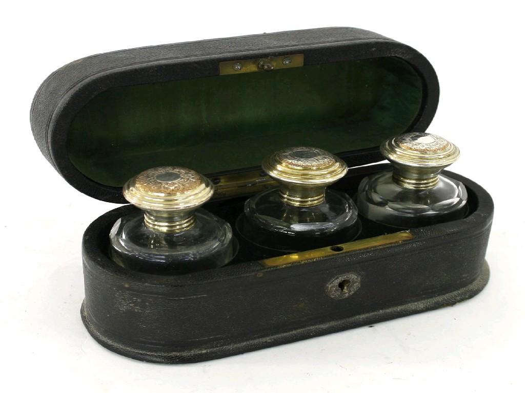 Appraisal: Set of three travelling circular ink bottles with engraved plated