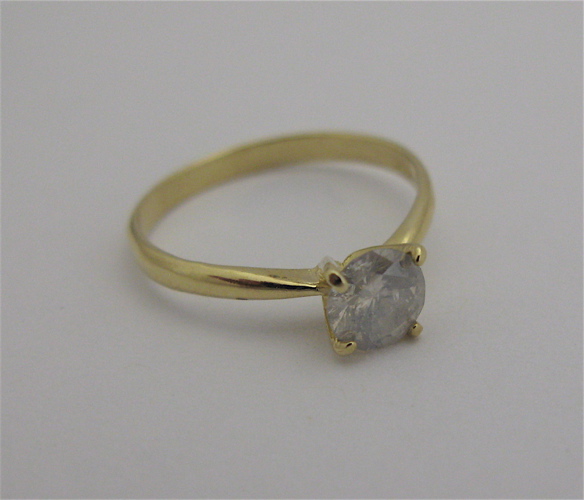 Appraisal: DIAMOND AND KARAT GOLD SOLITAIRE RING centered and prong set