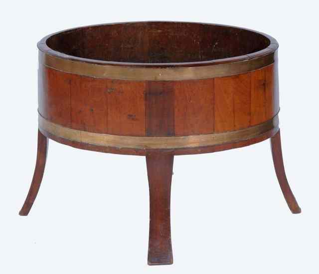 Appraisal: A LATE VICTORIAN MAHOGANY PLANTER of oval form with brass