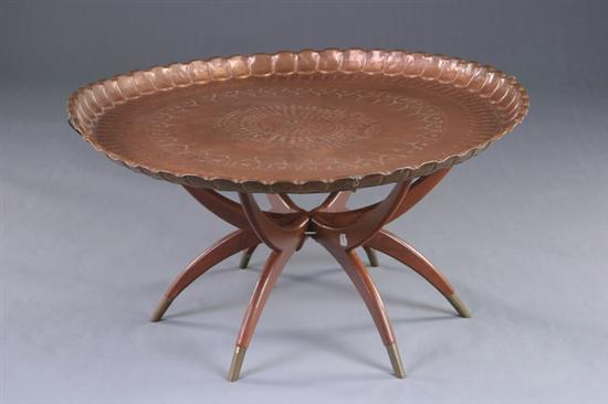 Appraisal: MIDDLE EASTERN TRAY-TOP TABLE th century copper With chaised borders