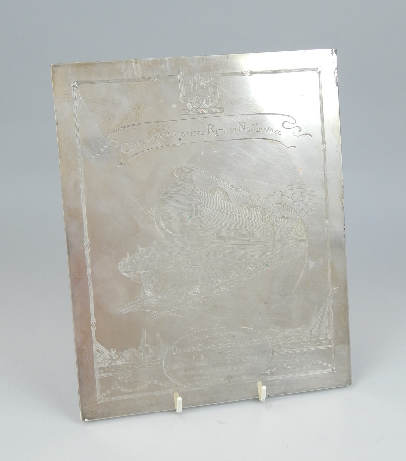 Appraisal: An unusual engraved silver plated railway plaque presented to a