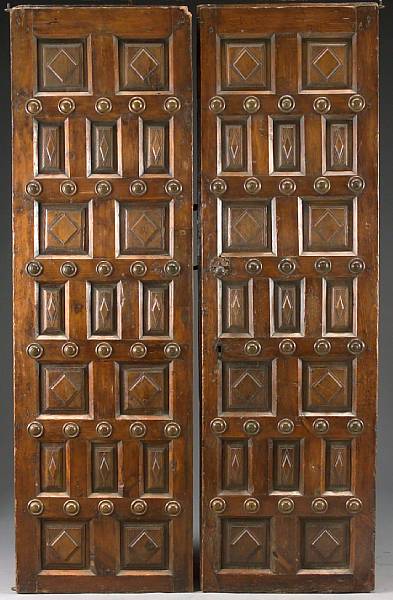 Appraisal: A pair of Spanish Colonial pine doors third quarter th